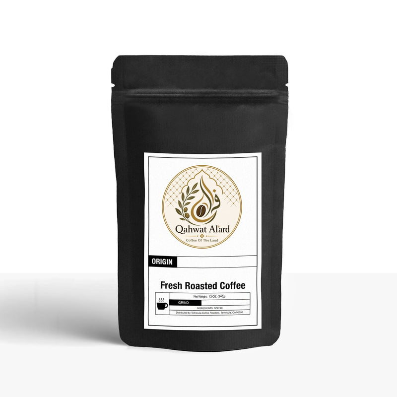 Black coffee bag with a white label featuring 'Qahwet Alard' on a white background